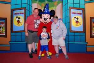 Eric, Carter, and Darah with Mickey during a 2014 trip to Disney in Florida.